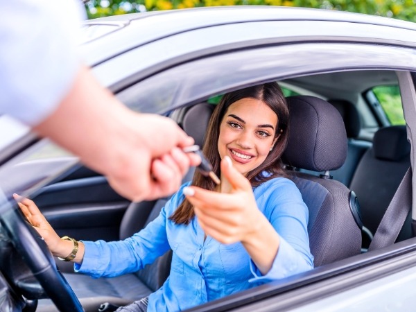 Woman Receiving a Car Key