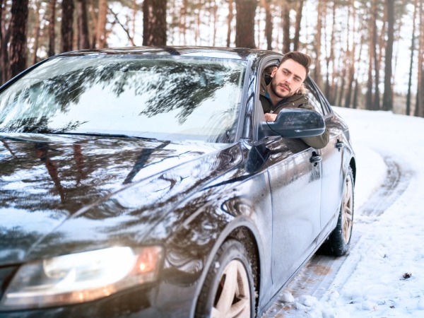 Man Driving on Winter Roads