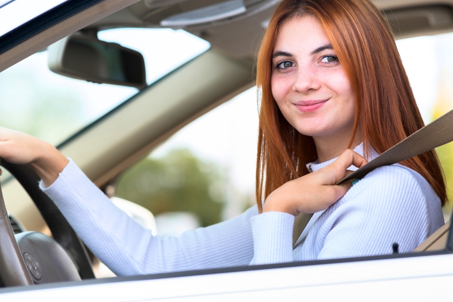 Woman Driving a White Car